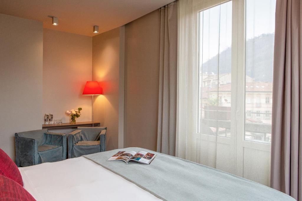 Postel nebo postele na pokoji v ubytování Posta Design Hotel