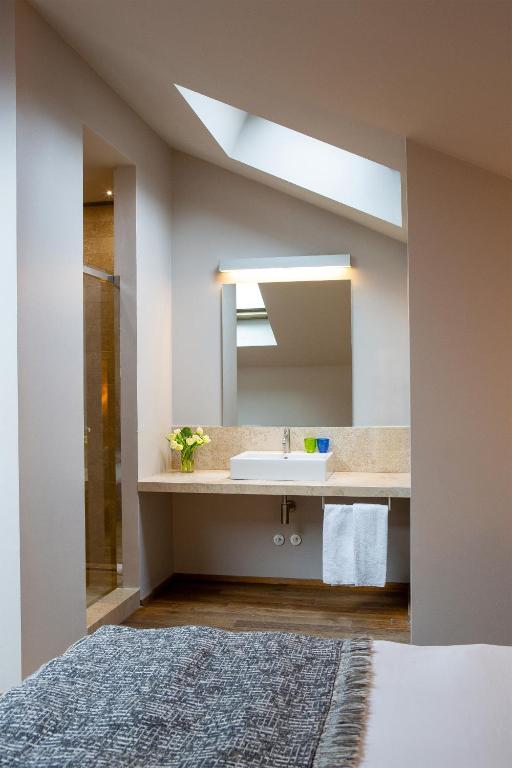 Postel nebo postele na pokoji v ubytování Posta Design Hotel