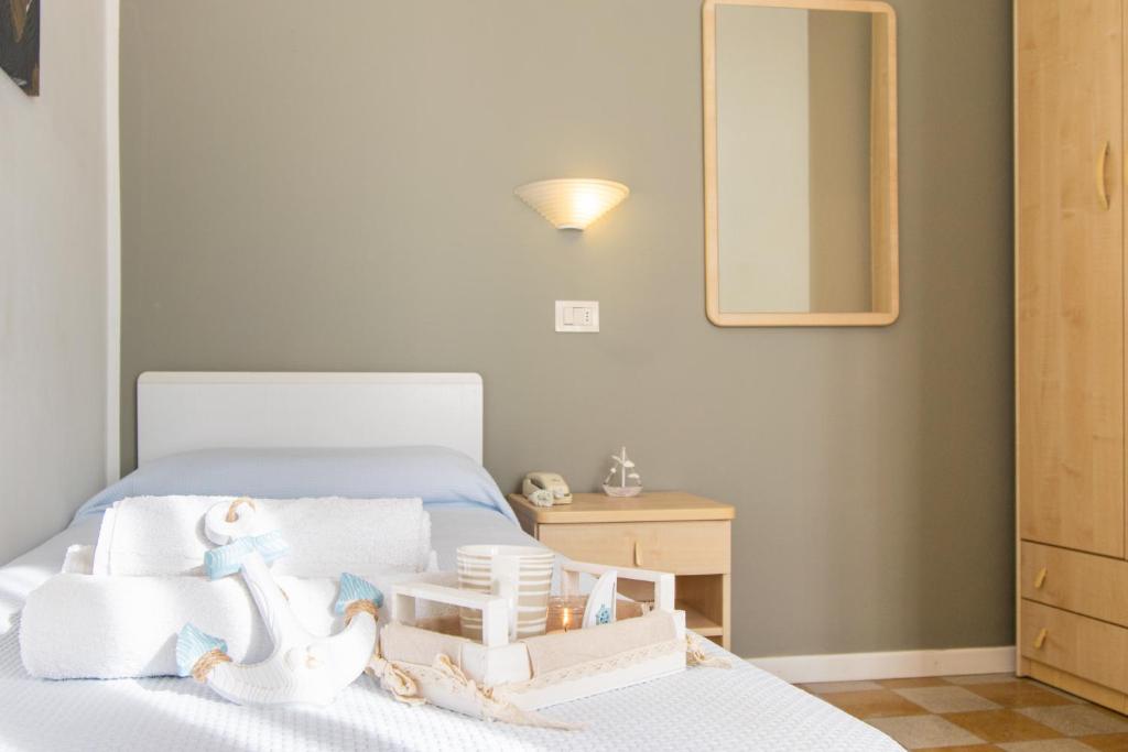 Postel nebo postele na pokoji v ubytování Hotel Lucciola