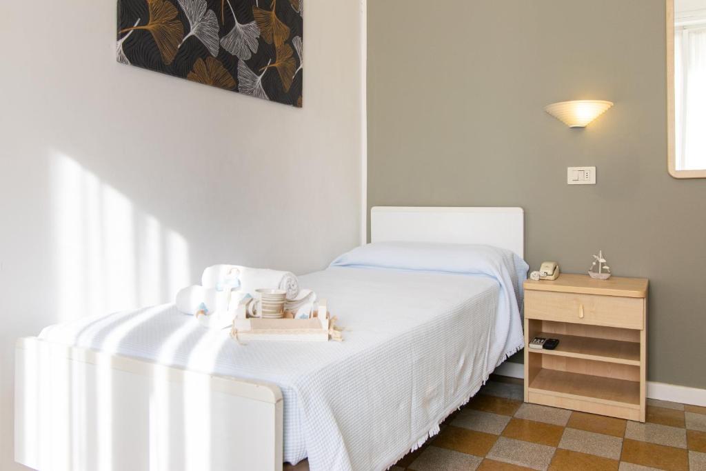 Postel nebo postele na pokoji v ubytování Hotel Lucciola