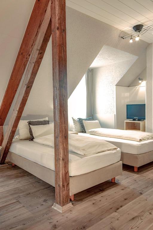 Postel nebo postele na pokoji v ubytování Hotel Wilhelmshöhe Auderath