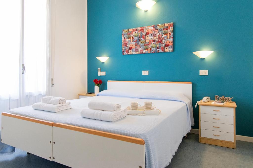 Postel nebo postele na pokoji v ubytování Hotel Lucciola