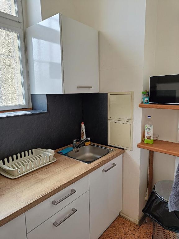 Kuchyň nebo kuchyňský kout v ubytování A Plus Hostel - Centrum