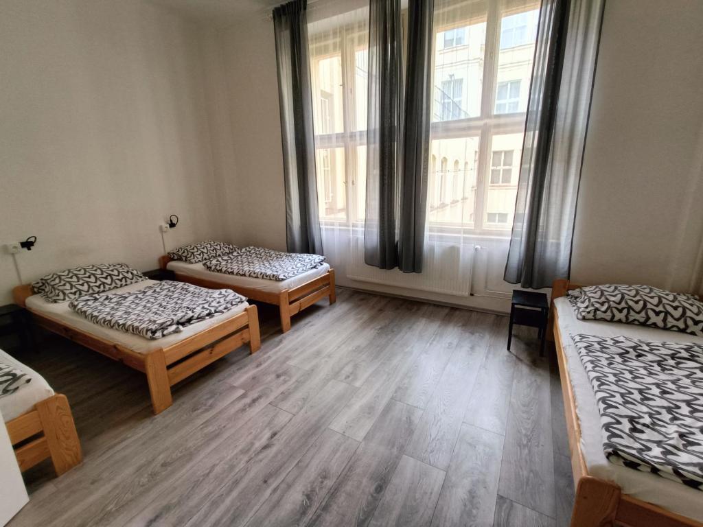 Postel nebo postele na pokoji v ubytování A Plus Hostel - Centrum
