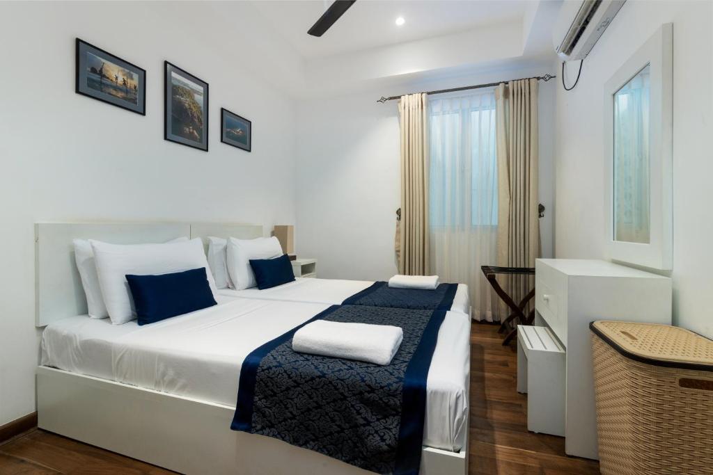 Postel nebo postele na pokoji v ubytování Oceanfront Condominium - Nilaveli