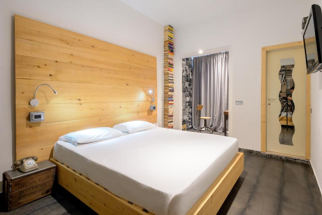 Postel nebo postele na pokoji v ubytování Hotel Perla - The storyhoteller
