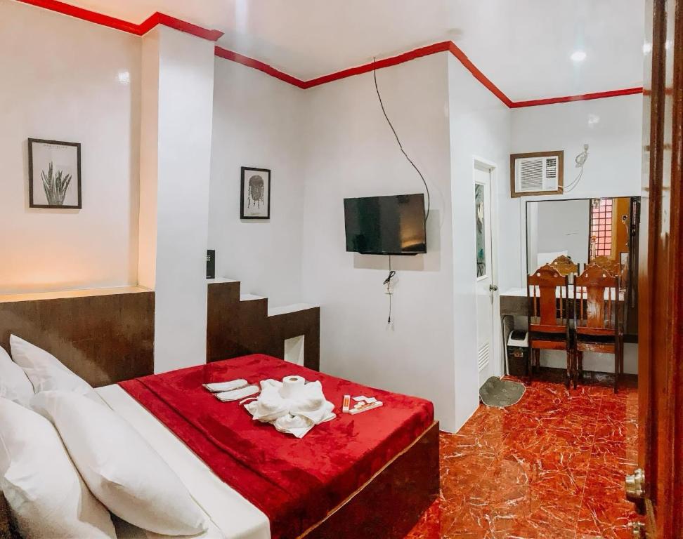 Postel nebo postele na pokoji v ubytování Victoria's Inn