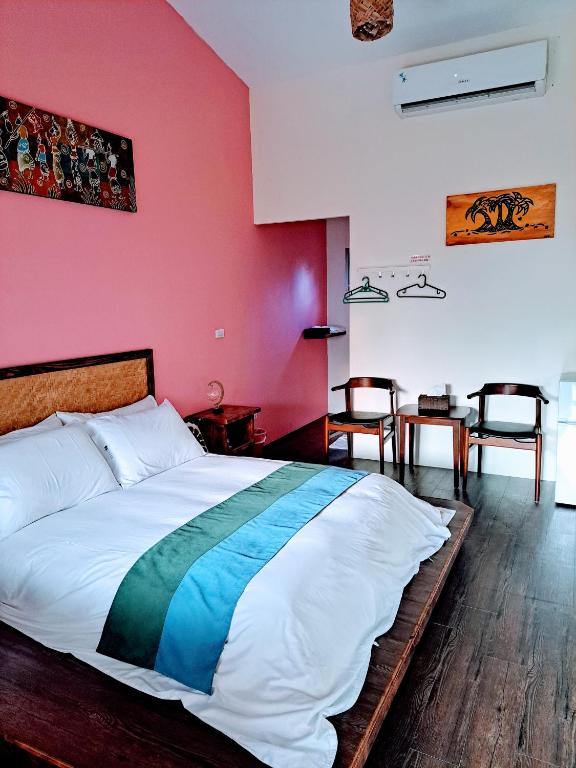 Postel nebo postele na pokoji v ubytování 墾丁夏旅Villa-可包棟