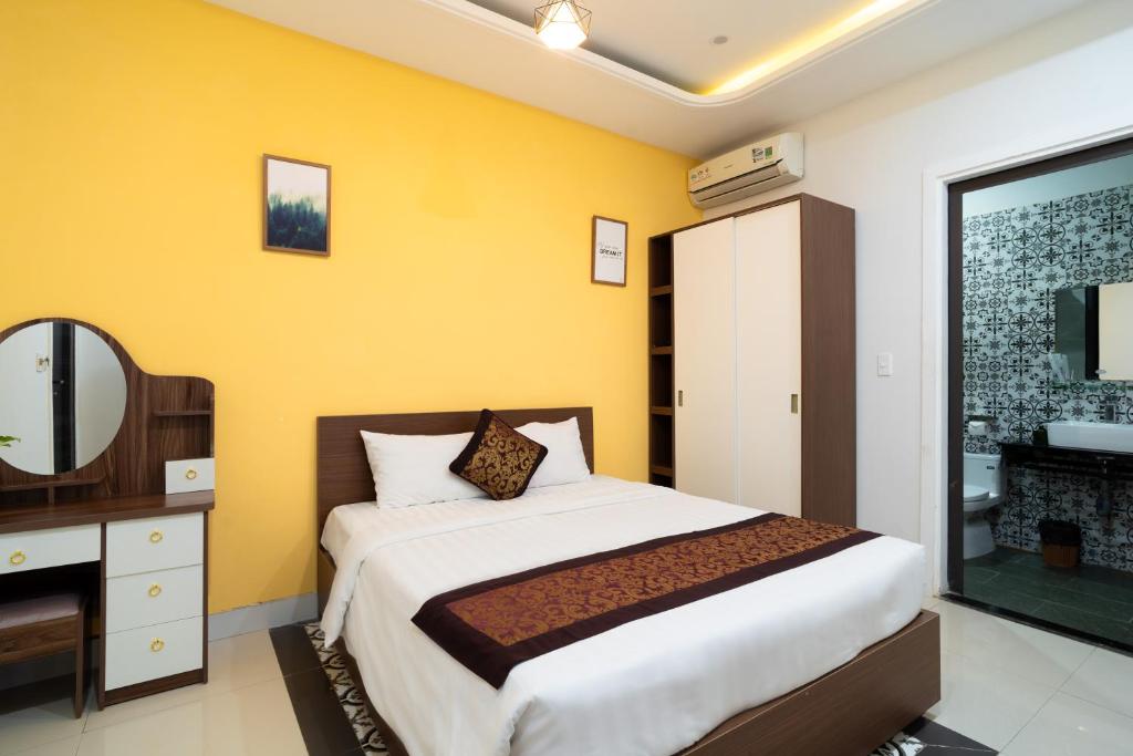 Postel nebo postele na pokoji v ubytování HAI DAO HOI AN VILLA