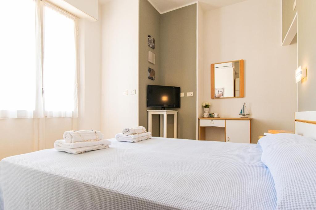 Postel nebo postele na pokoji v ubytování Hotel Lucciola