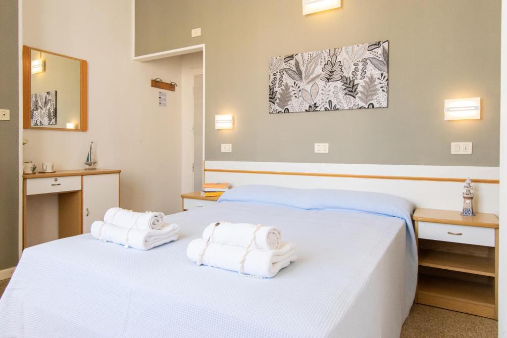 Postel nebo postele na pokoji v ubytování Hotel Lucciola