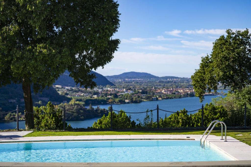a swimming pool with a view of the water at Villa Anna Lake View in Pilzone