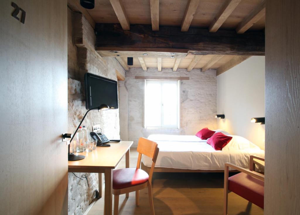 Postel nebo postele na pokoji v ubytování 'S Hertogenmolens Hotel