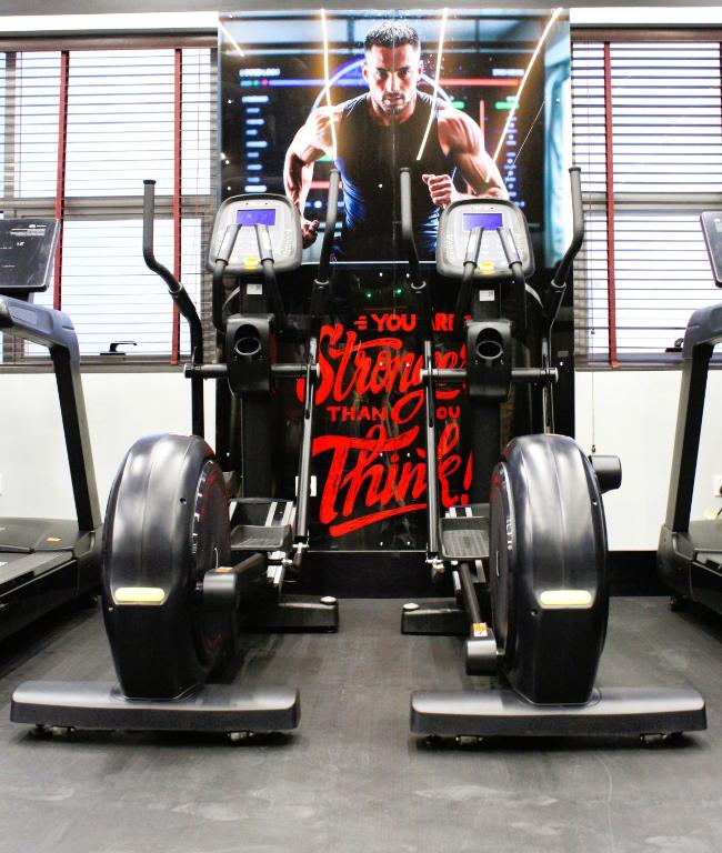 a car in a gym with a poster on it at City Tower Hotel in Fujairah