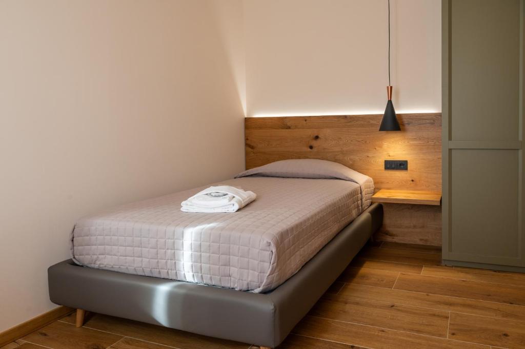 Postel nebo postele na pokoji v ubytování AURA Dimore ad Arquà Petrarca