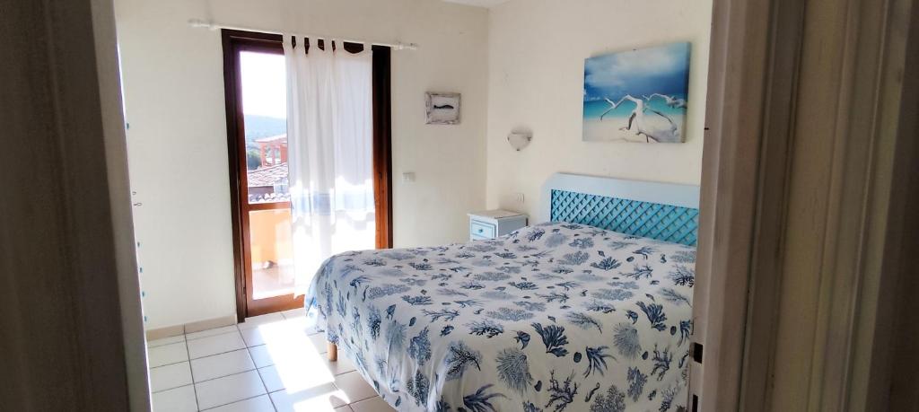 Łóżko lub łóżka w pokoju w obiekcie Sardegna Top Golfo Di Marinella