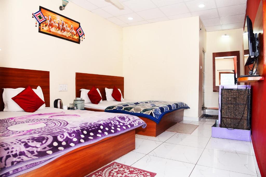 Voodi või voodid majutusasutuse Samarth home stay toas