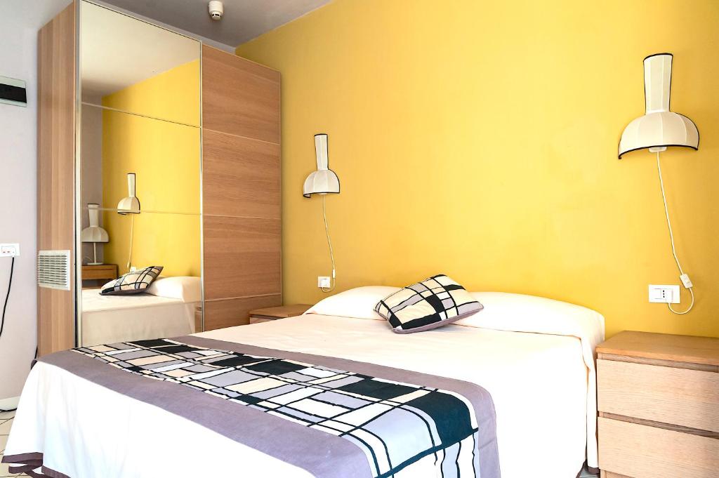 Postel nebo postele na pokoji v ubytování HOTEL TRIONFAL - Fronte Mare - Vicinissimi al Centro