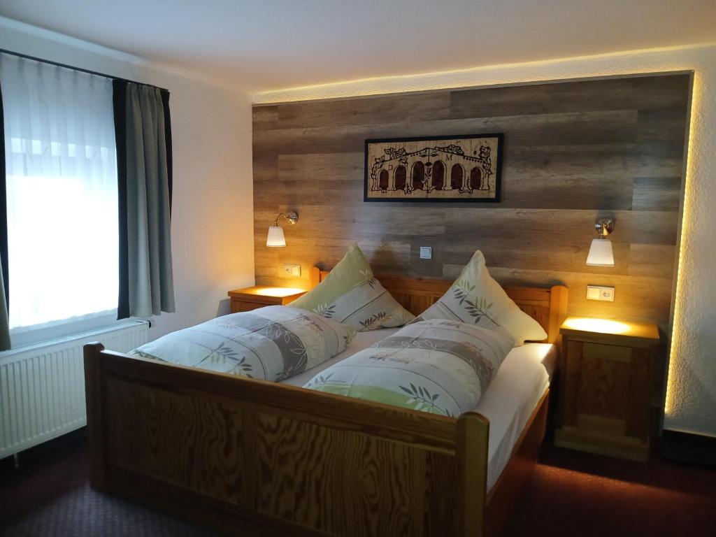 Postel nebo postele na pokoji v ubytování Hotel Jägerhalle