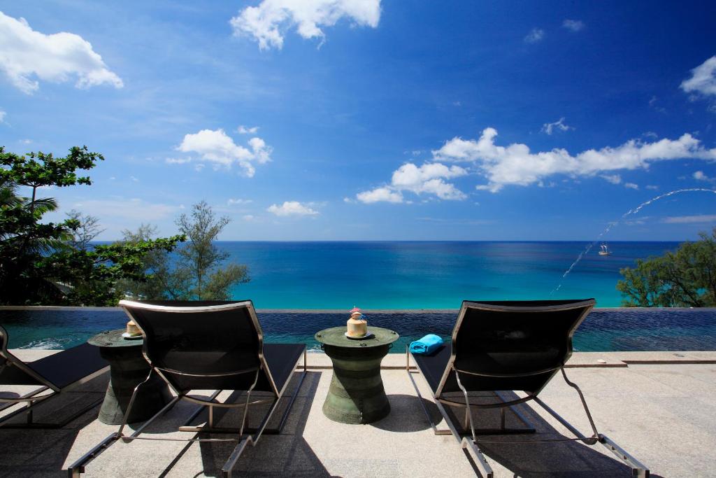 a view of the ocean from a resort patio at Bluesiam Villas - SHA Certified in Surin Beach