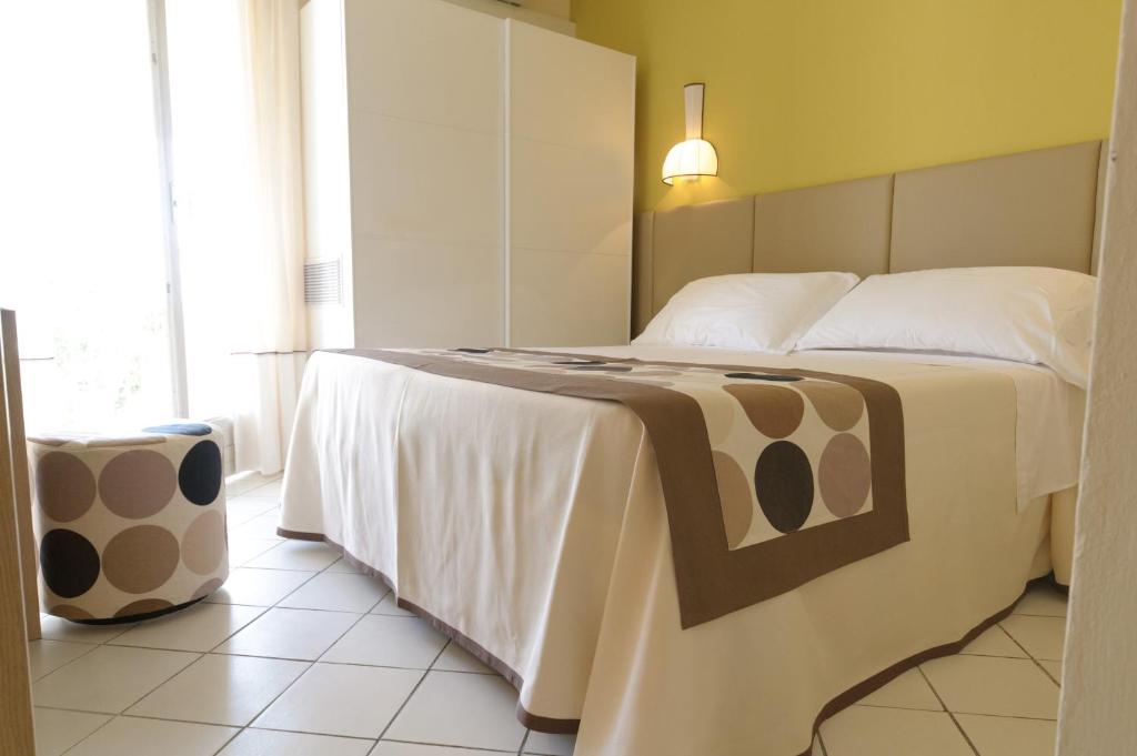 Postel nebo postele na pokoji v ubytování HOTEL TRIONFAL - Fronte Mare - Vicinissimi al Centro