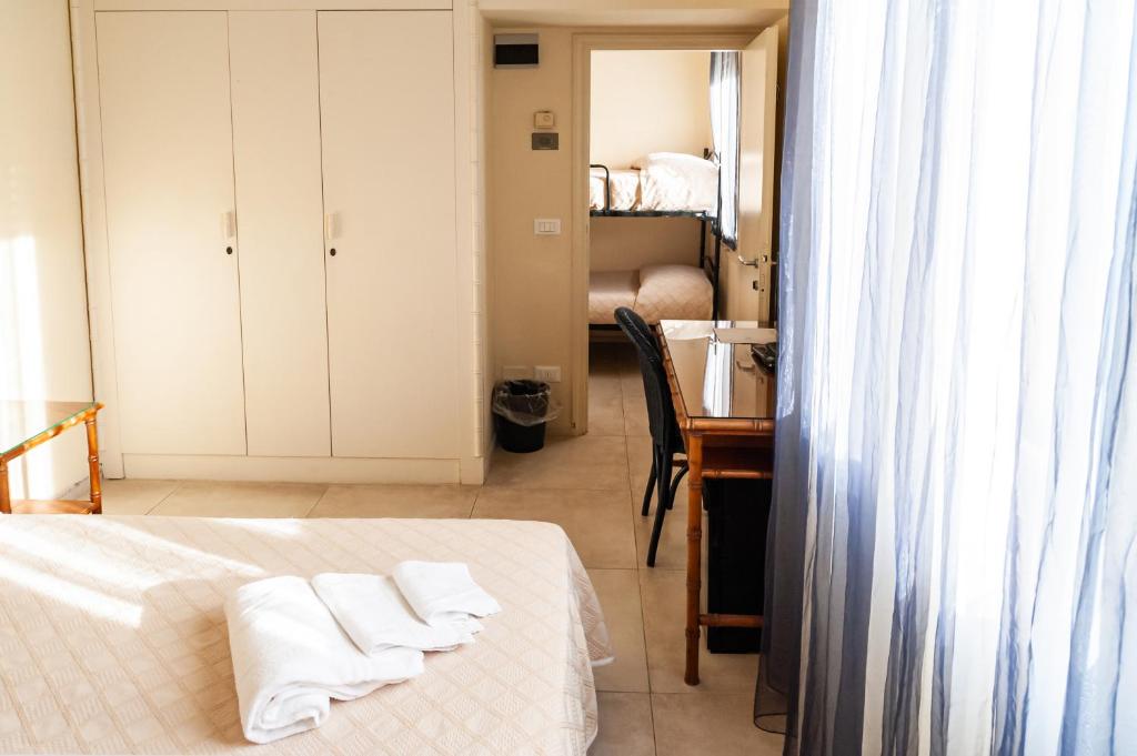 Postel nebo postele na pokoji v ubytování HOTEL TRIONFAL - Fronte Mare - Vicinissimi al Centro