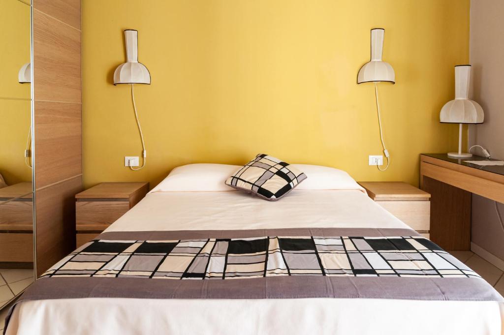 Postel nebo postele na pokoji v ubytování HOTEL TRIONFAL - Fronte Mare - Vicinissimi al Centro