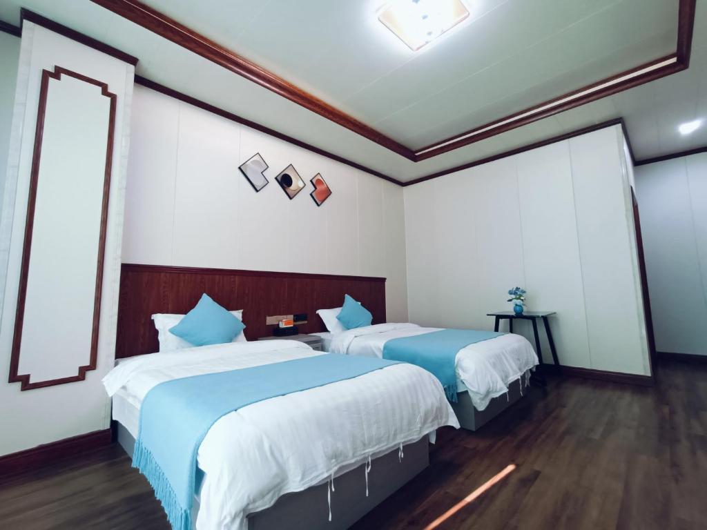 Postel nebo postele na pokoji v ubytování Meizhou Cloudy B&B
