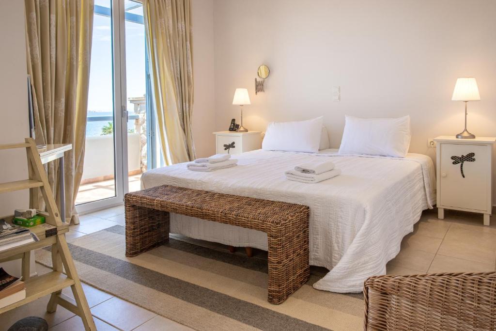 Postel nebo postele na pokoji v ubytování Neapoli Villas