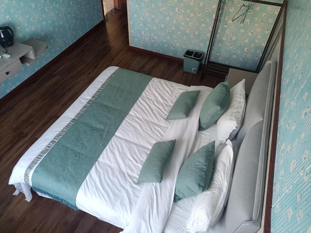 Postel nebo postele na pokoji v ubytování Meizhou Cloudy B&B