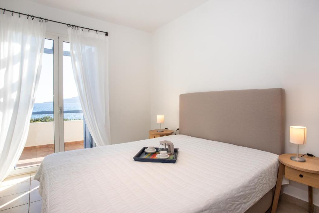 Postel nebo postele na pokoji v ubytování Neapoli Villas