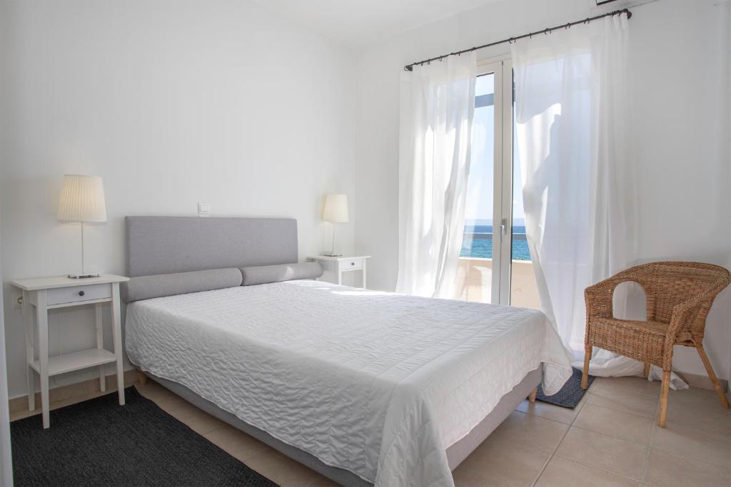 Postel nebo postele na pokoji v ubytování Neapoli Villas