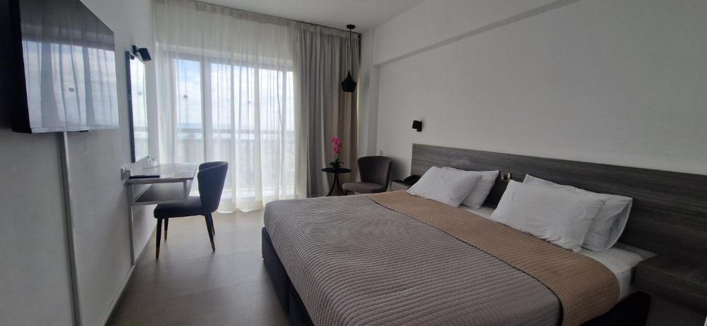 Postel nebo postele na pokoji v ubytování Navarria Blue Hotel