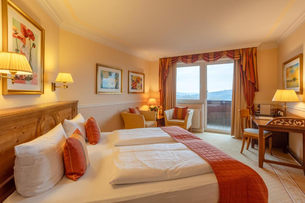 Postel nebo postele na pokoji v ubytování Natur- und Wohlfühlhotel Kastenholz