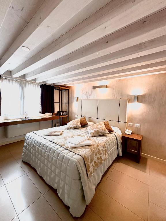 Postel nebo postele na pokoji v ubytování Al Canal Regio - Guest House