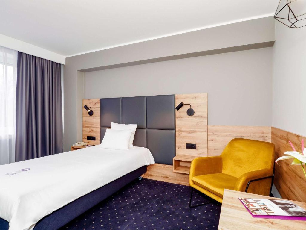 Posteľ alebo postele v izbe v ubytovaní Mercure Czestochowa Centrum