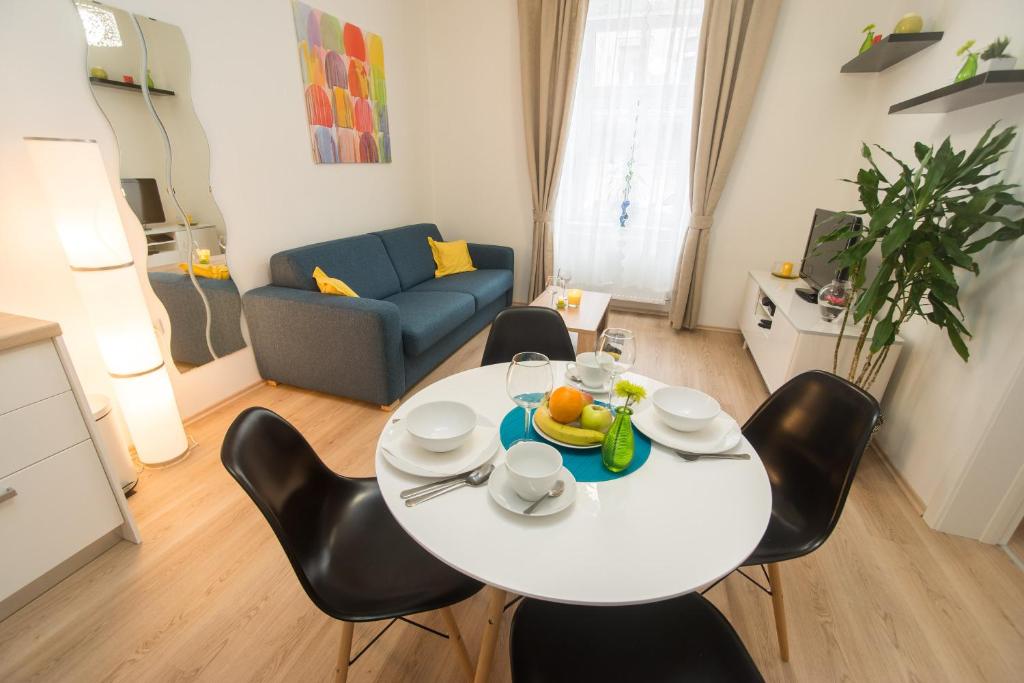 a white table and chairs in a living room at Zagreb Central in Zagreb