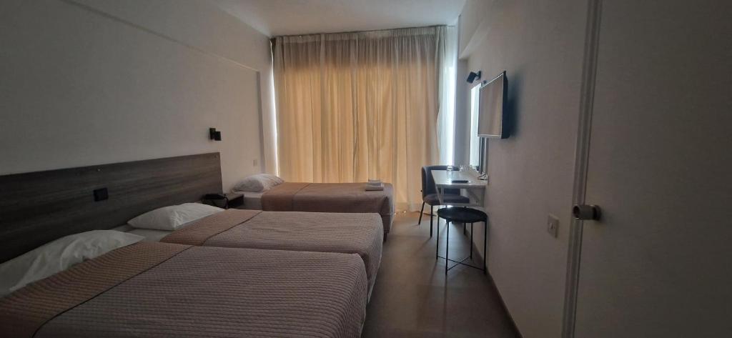 Postel nebo postele na pokoji v ubytování Navarria Blue Hotel