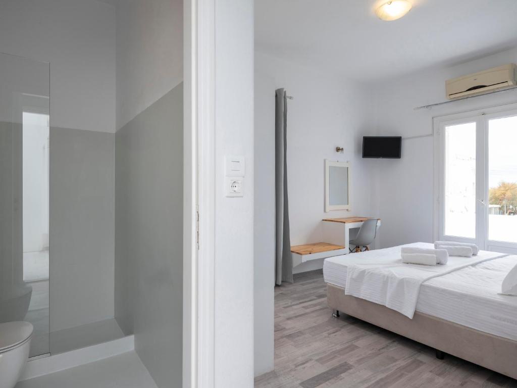 Postel nebo postele na pokoji v ubytování Grozos Rooms