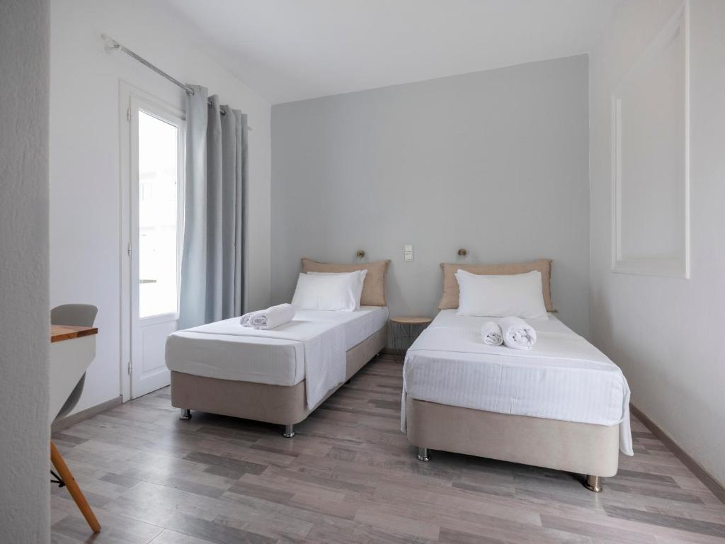 Postel nebo postele na pokoji v ubytování Grozos Rooms