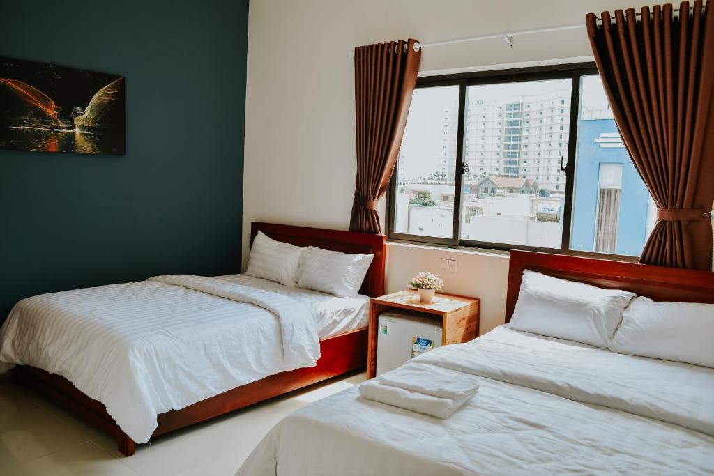 Postel nebo postele na pokoji v ubytování Talofofo Hostel