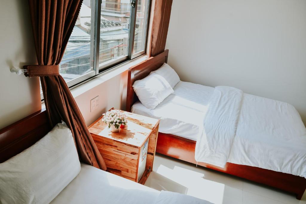 Postel nebo postele na pokoji v ubytování Talofofo Hostel
