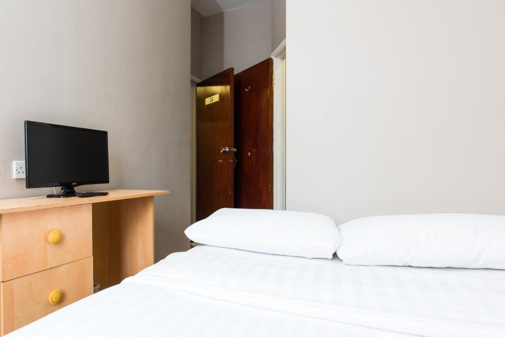 Postel nebo postele na pokoji v ubytování Aquarius Hotel