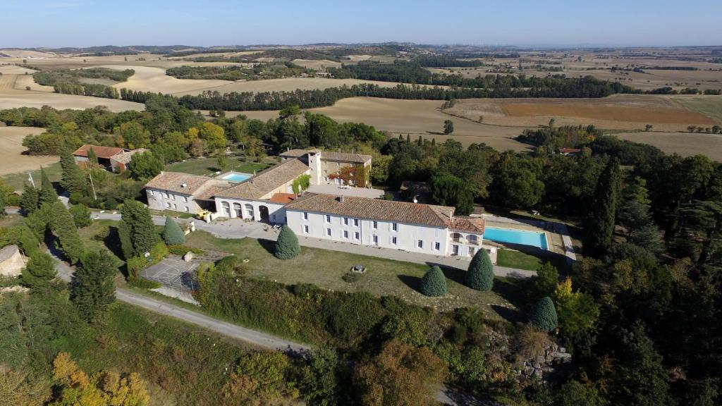 an aerial view of a house on a hill at La Ginelle - Appartement Guy in Airoux