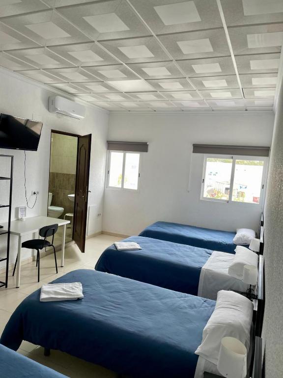 Postel nebo postele na pokoji v ubytování Hostal Kaizen