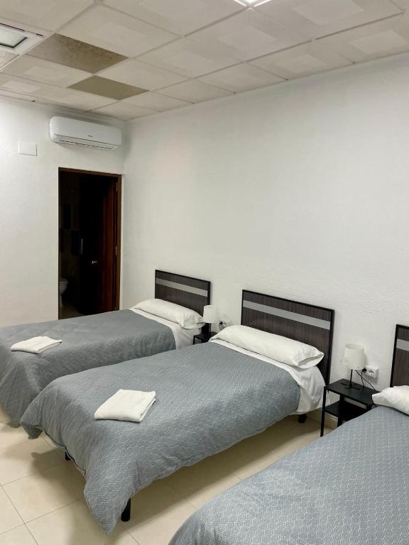 Postel nebo postele na pokoji v ubytování Hostal Kaizen