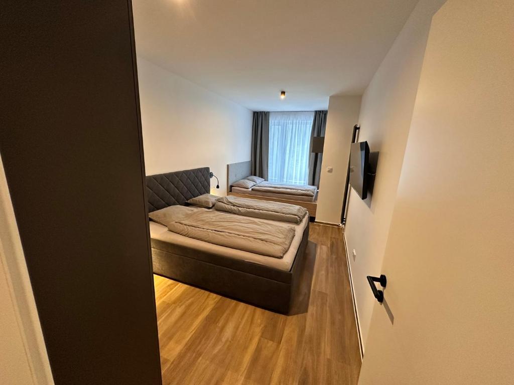 Letto o letti in una camera di SORRY-HORY Apartmán Dolní Morava