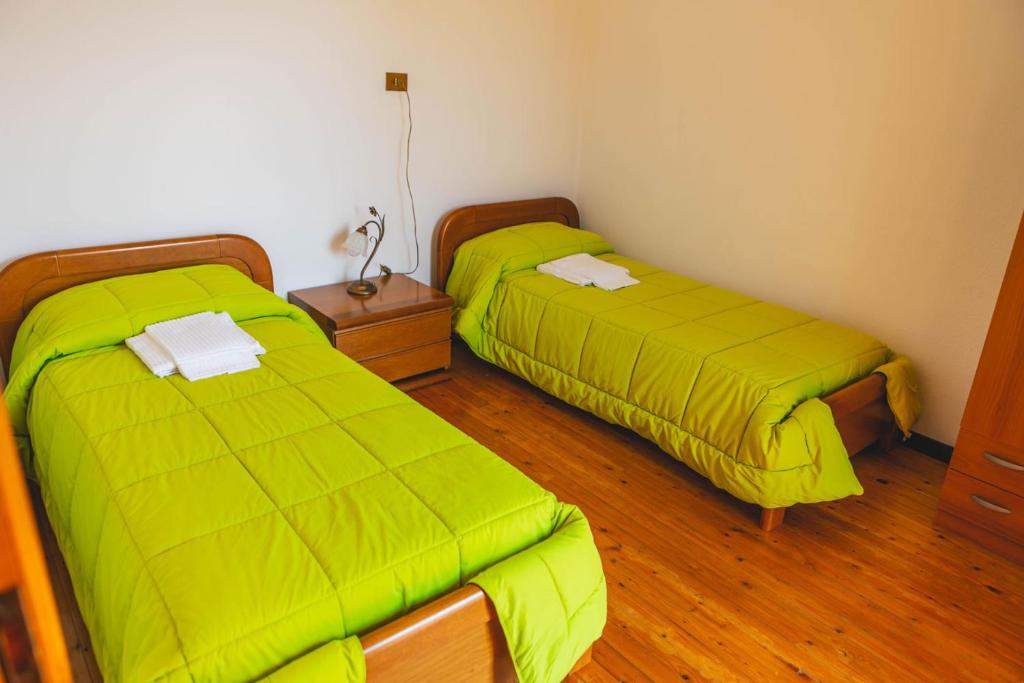 Postel nebo postele na pokoji v ubytování B&B Il Paradiso Mozzio