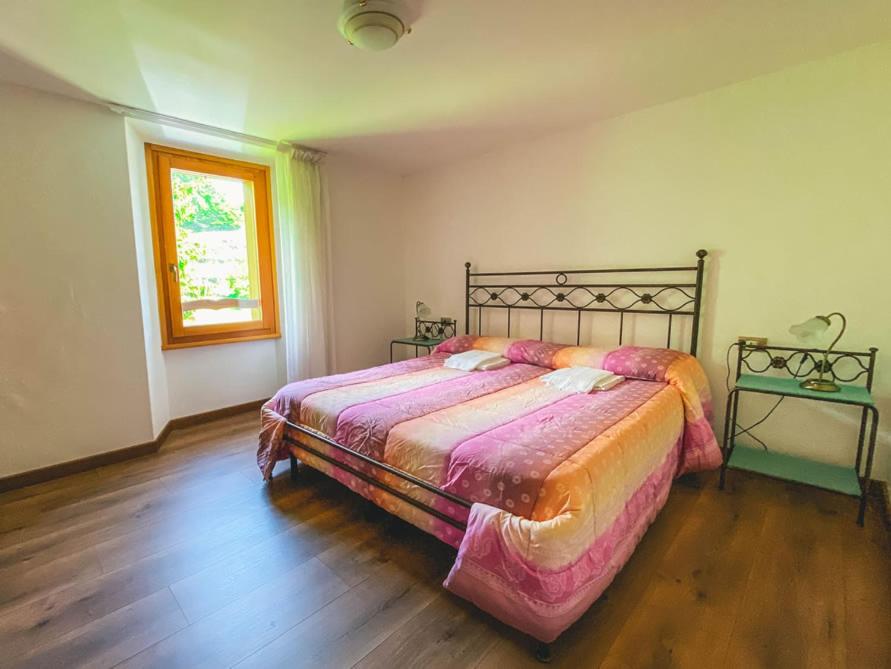 Postel nebo postele na pokoji v ubytování B&B Il Paradiso Mozzio