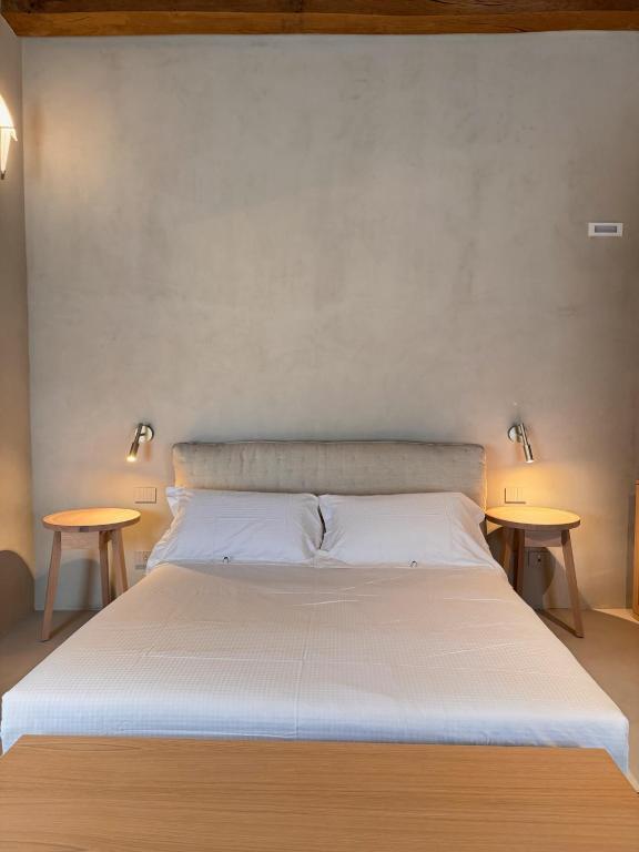 Postel nebo postele na pokoji v ubytování Relais La Colombaia